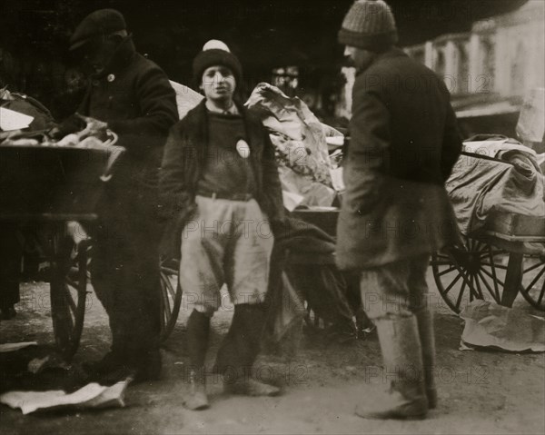 Young vendor with badge 1917