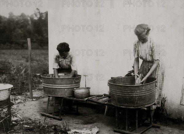 Zelina & Florence Richards, 12 and 13 years old doing the family wash 1916