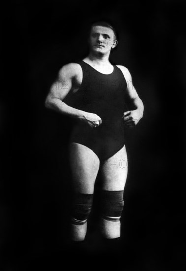 Bodybuilder in Wrestling Outfit and Knee Pads