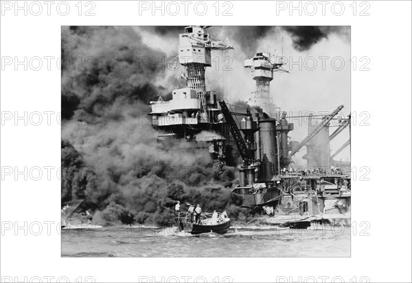 USS West Virginia alight in Pearl Harbor 1941