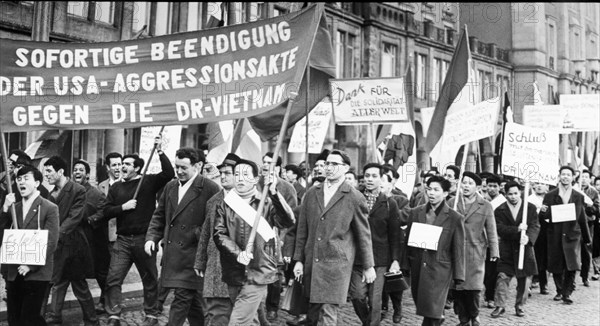 The foreign students at the dresden university protest against u,s, attacks in vietnam.