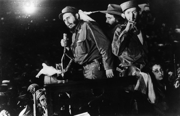 Fidel castro ruz addressing the cuban people in columbia city (later freedom city) after his victory, january 1959, cuban revolution, behind castro, on the right is commander camilo cienfuegos, cuban revolutionary leader.