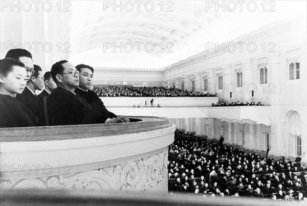 The north korean government delegation attending the fifth session of the supreme soviet of the ussr - a joint sitting of the soviet of the union and the soviet of nationalities, march 1949, sitting in the balcony are pak heun yung (pak hen yen) (in glasses), and kim il sung.