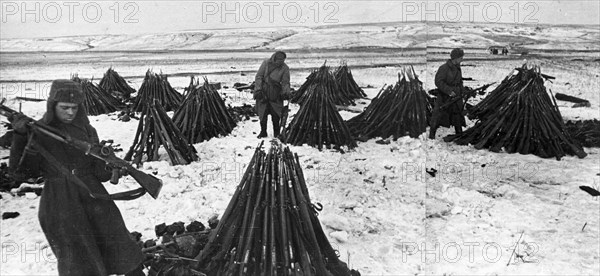 World war 2, battle of stalingrad, nortwest of stalingrad, soviet soldiers counting the captured rifles, february 1943.