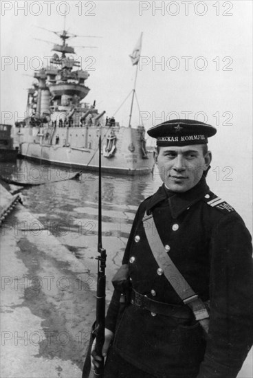Black sea fleet, a soviet sailor on watch at the battleship paris commune, march 1943.