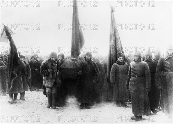 Lenin's funeral, members of the politburo (joseph stalin, left front) carrying the casket into the crypt near the kremlin wall in red square, moscow, january 1924.