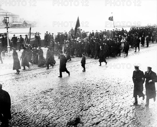 Students of university quay demostrate with red flags in petersburg in 1905.