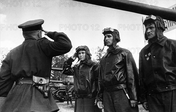 The boiko's tank unit receives new js-122 (joseph stalin 122) heavy tanks, 1942, tank commander,  junior lieutenant alexandra boiko and her husband, driver/mechanic ivan boiko, the unit commander entrusts the boiko crew with their tank.