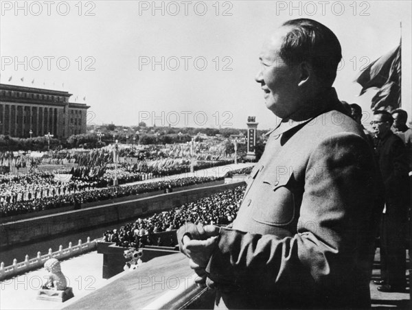 Chairman mao zedong on the rostrum in tienanmen square viewing a parade in honor of the 14th anniversary of the founding of the people's republic of china, beijing, china, october 1963.