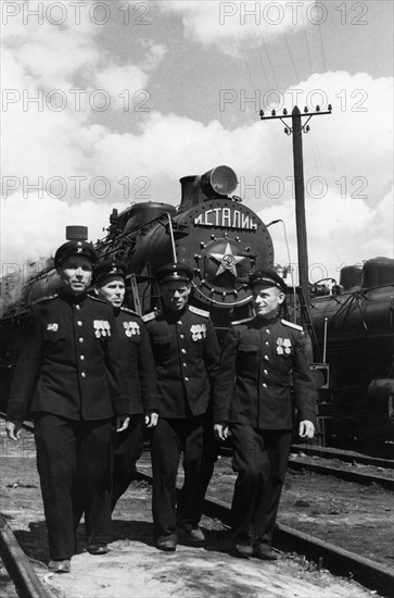 The four korotkov brothers who work at the novosibirsk locomotive depot, they come from a family of generations of railway men, vasili and nikolai were awarded the order of lenin, and vladimir and georgi received the red banner of labor, july 1951, (left to right) vasili, georgi, nikolai and vladimir korotkov.