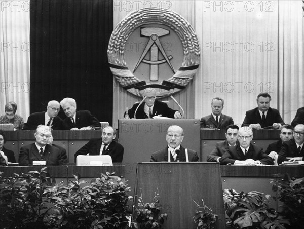 Walter ulbricht, state council chairman of the gdr, speaking on 'the constitution of the socialist society and its socialist state of the german nation' and gave his report as the chairman of the commission preparing the draft for a socialist constitution to the 7th session of the people's chamber (parliament) held in the congress hall on berlin's alexander square on january 31, 1968.
