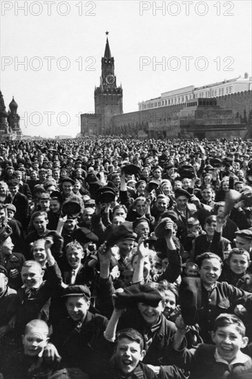 Happy moscow crowds fill red square during victory day celebrations in moscow, ussr, may 9, 1945.