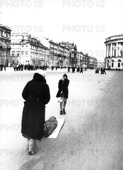 Victims of nazi bombing, taking a dead child to be buried during leningrad blockade, 1942.