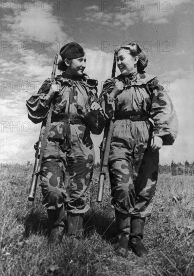 World war 2, volunteer snipers r, skrypnikova (rt) and o, bykova returning from a combat assignment.