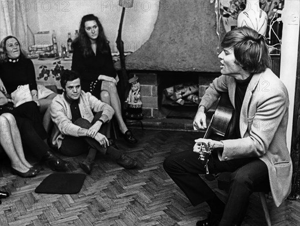 American singer, actor and director dean reed giving an impromptu performance for his hosts in warsaw, poland, december 1970.