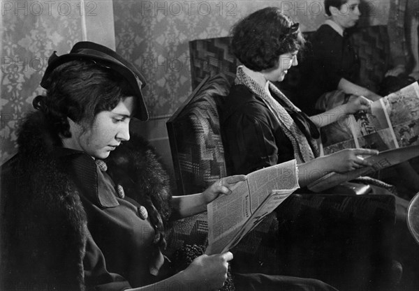 Women clients in the waiting room of the moscow institute of cosmetology and hygiene, opened in january by 'glavperfume', an abbreviated name for the chief administration of the state perfume and cosmetics industry, february 1937.