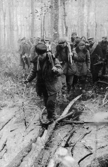 A detachment of byelorussian partisans on a combat assignment in the pinsk marshes, january 1944, world war 2.