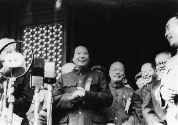 Chairman mao tse tung (center) at the ceremony announcing the founding of the people's republic of china, october 1, 1949, peking (beijing), china, to mao's right: general chu teh, far right: chou en-lai.