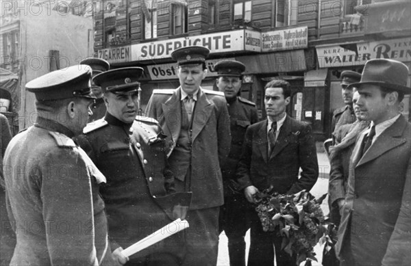 Colonel-general berzarin, soviet commandant of berlin (second from left) chatting with officials of the berlin subway after a ride on the underground railway, 1945 or 1946.