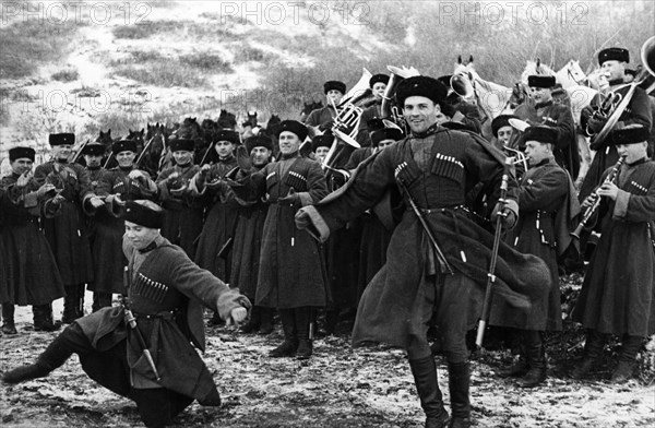Soviet red army cossacks enjoying a little downtime by giving a traditional dance performance, february 1938.
