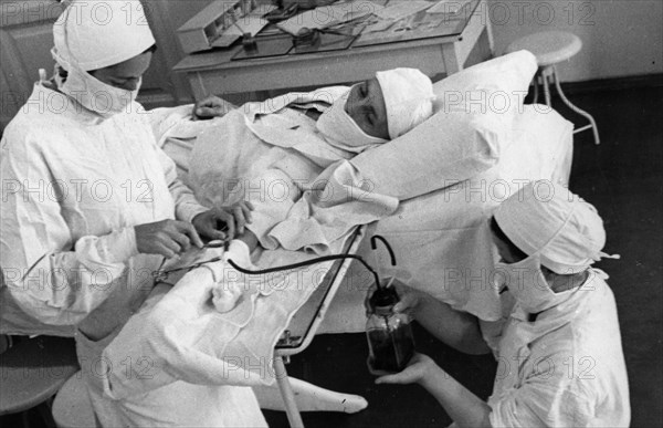 Soviet blood bank, ussr, 1938, blood donor giving a donation.