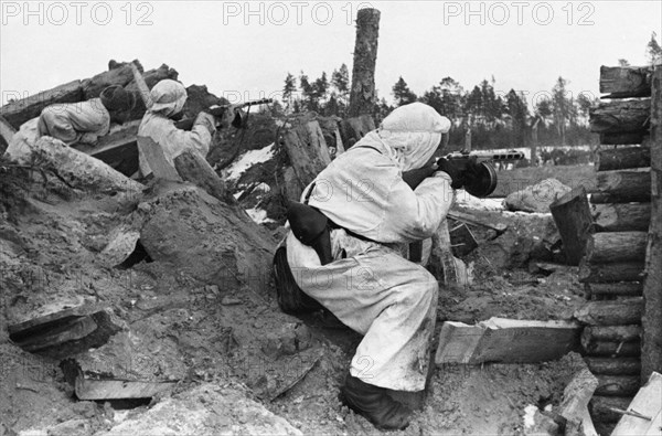 Red army tommy-gunners who have captured a german fortification firing on a retreating enemy, april 1944.