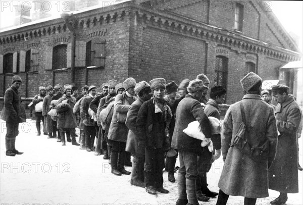 Formation of a regiment made up of poor villagers in the courtyard of their barracks in 1918 during the civil war, petrograd.