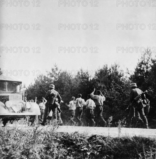 Nazi invasion of poland, german soldiers with polish p,o,w,s in september 1939.