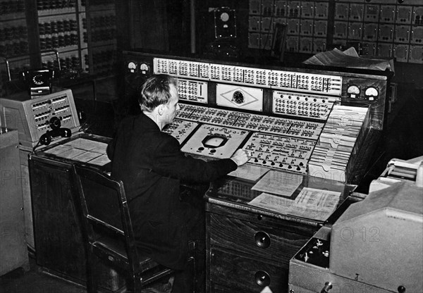 A technician at the control board of the strela-1, a general purpose computer at the calculating center of moscow's ussr academy of sciences, 1950s.
