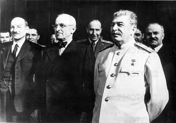 Stalin, truman, attlee (left), and molotov (right) at the berlin conference of the heads of the governments of ussr, gb and u,s,a, in 1945.