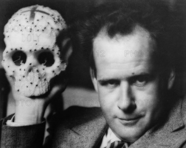 Sergei eisenstein, famous russian (soviet) film director, eisenstein on location holding a skull prop.