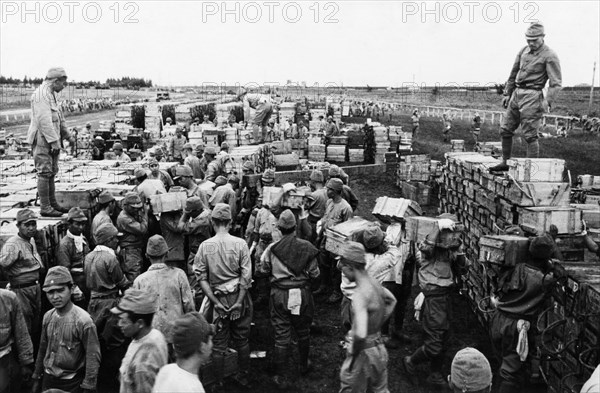 World war 2, harbin, japanese soldiers stacking ammunition to be turned over to the red army, 1945.