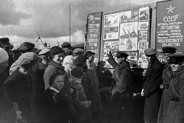 Lieutenant of a soviet tank unit lectures vilno inhabitants about the lives of workers in the ussr, october 1939, vilno, capital of lithuania,  was annexed by poland between 1920-1939, occupied by soviet army in september 1939, annexed with the rest of the lithuania to ussr in 1940.