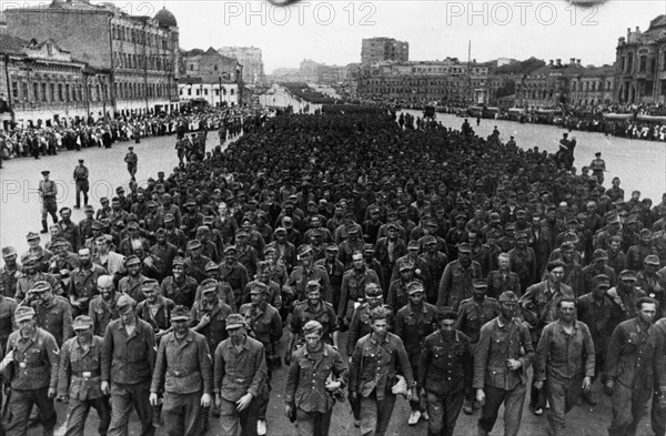 World war 2, 57,600 german soldiers, taken prisoner in the last few days by the troops of the 1st, 2nd, and 3rd belorussian fronts, being marched through the streets of moscow on their way to pow camps, july 17, 1944.