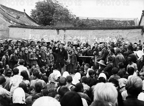 Land reform in china, one in a series of meetings held to explain the agrarian reform law in ma wa village, henan province in the early 1950s.