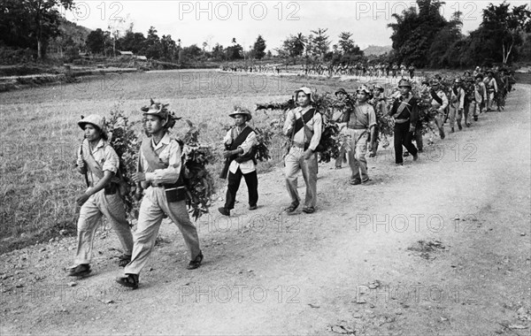 Troops of the south vietnam liberation army marching towards the front along the ho chi minh trail, vietnam war, september 1966.