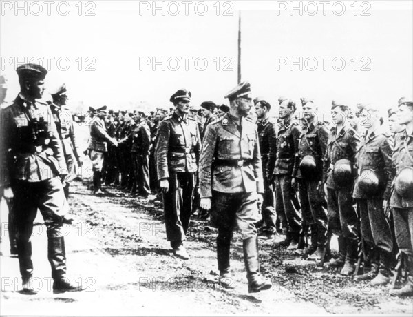 Heinrich himmler reviews the guard of honour during his visit to the ss 'viking' division in september 1942.