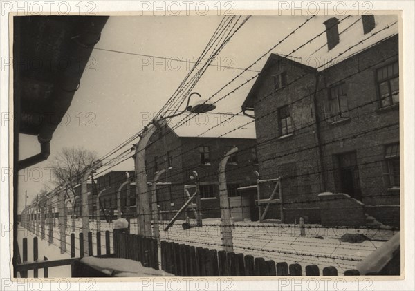 Photo-series on the hitlerite death camp in oswiecim,  person who entered the gate of oswiecim never returned from there,  the camp was surrounded by a barbed wire fence charged with high tension electric current, february, 1945.