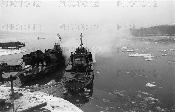 World war 2, soviet armored cutters 'stalinets' and 'hero of the soviet union golubets' of the soviet danube military flotilla moored at the hungarian bank of the danube river, february 1945.