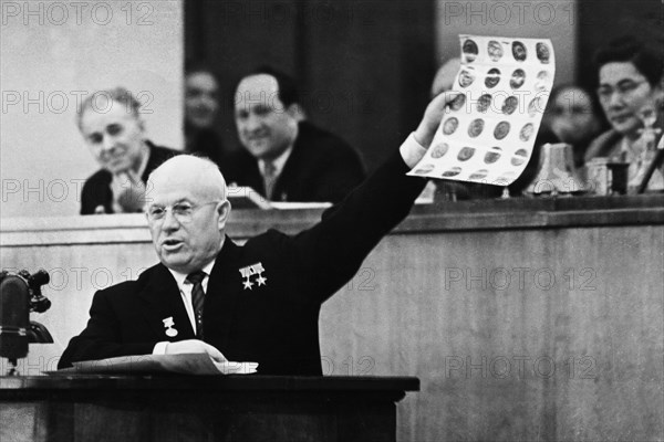 Soviet premier, nikita khrushchev, showing photographs of objects found in the u2 spy plane that was shot down over soviet territory on may 1st, 1960, joint session of council of the union and council of nationalities, kremlin, moscow, may 7th, 1960.