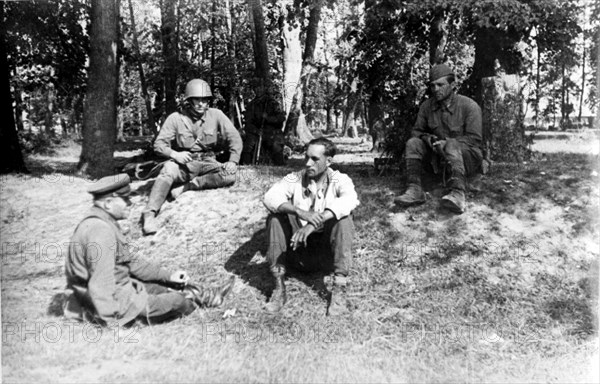 A red army officer questions nazi pilot herbert buschman who was captured after bailing out of his burning plane,the previous day he had attacked and set fire to a collective farm village, but returning the next day he was attacked by a soviet fighter who shot off a wing of the german plane, sending it crashing to the ground, world war ll.