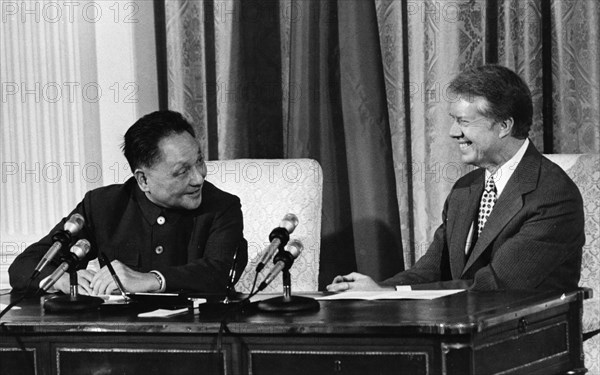 Chinese vice-premier deng xiaoping and us president jimmy carter during the signing of the us/china scientific and technological cooperation agreement and a cultural agreement at the white house on january 31, 1979.