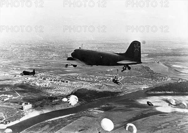 World war 2, soviet li-2 plane dropping paratroopers.