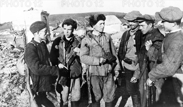 Guerrillas who returned to their native village liberated by the red army during world war ll.