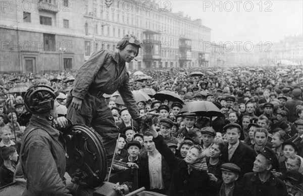 Victory parade in red square, moscow, ussr, june 24th, 1945, celebrating end of world war 2 in europe, moscow people greet soviet tank crew.