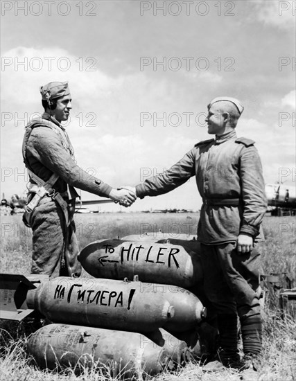 Hands across the world' symbolizes the vow of two great allies, the united states and russia, sargeant anthony gioia, a waist gunner in a b-17 flying fortress who took part in the first american shuttle mission to russia, shaking hands with a red army soldier, 1944.