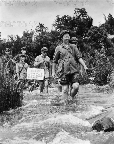 A medical team (barefoot doctors) led by communist party member ma yi is active in the wuchih mountains area, serving the peasants of the li nationality, china, 1968, cultural revolution.