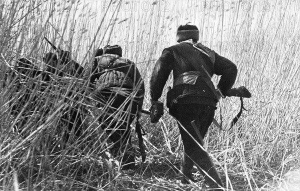 World war 2, russian partisans on their way to an ambush behind enemy lines, july 1942.