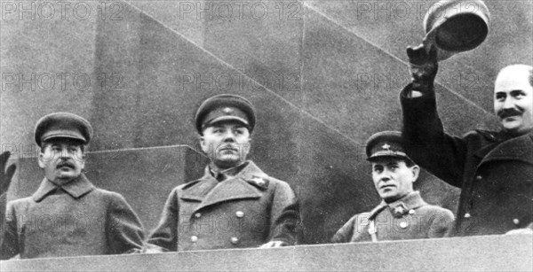 Red square, moscow, ussr, may day 1937, left to right: josef stalin, k, voroshilov, nikolay yezhov (head of nkvd), l,m, kagonovich on reviewing stand on top of lenin's tomb.