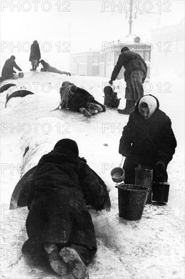 world war ll: people collecting water on the zvenigorod street in leningrad, during the blockade, jan, 1942.